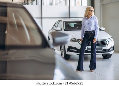 Buisness Woman Choosing A Car In A Car Showroom