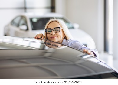 Buisness Woman Choosing A Car In A Car Showroom