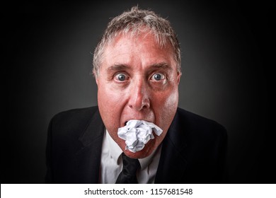 Buisnessman Eating Paper