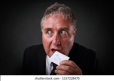 Buisnessman Eating Private Note