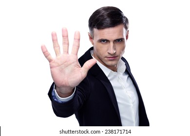 Buisnessman Making Stop Gesture Over White Background