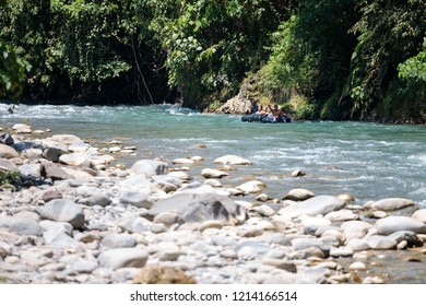 Bukit Lawang, Indonesia - October 15, 2018 - People Tubing Down The Bahorok River Rapids Flowing In Bukit Lawang, Sumatra, Indonesia.