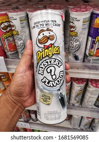 Bukit Tinggi, Malaysia - 21 March 2020 : Hand Hold A New PRINGLES Potato Crisps Mystery Flavour For Sell In The Supermarket With Selective Focus.