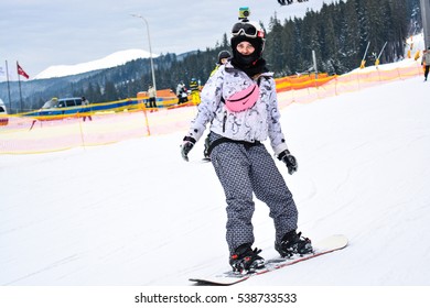 BUKOVEL, UKRAINE - December 17, 2016: Snowboarder With Go Pro On Head Enjoying On Slopes Of Ski Resort Bukovel. Bukovel Is The Most Popular Ski Resort In Ukraine. Ski Season And Winter Sports Concept