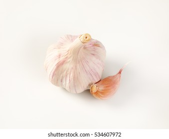 Bulb And Clove Of Fresh Garlic On White Background