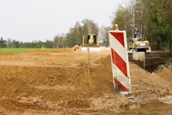 Buldozer moving earth. Road construction building work, a Transportation Photo by StockPhotosLV