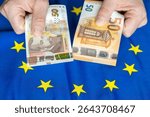 Bulgaria euro. Business and financial concept. 50 Bulgarian leva and a 50 euro bill in the other hand against the backdrop of the European Union flag.