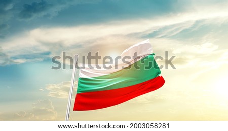 Bulgaria national flag waving in beautiful clouds.