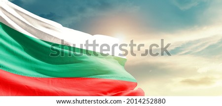 Bulgaria national flag waving in beautiful sky.