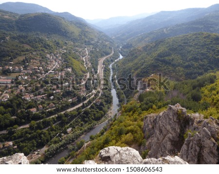Bulgaria september 2019. River Iskar, railroad near village Lakatnik and the mountain in autumn colors.