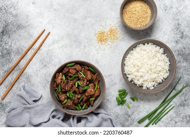 Bulgogi With Fried Pork And Rice. Traditional Korean Food. Gray Grunge Background. View From Above, Flat Lay