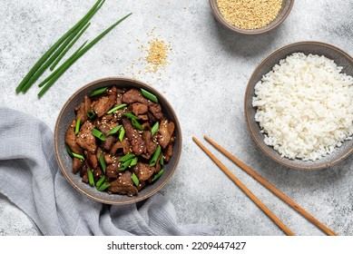 Bulgogi With Fried Pork And Rice. Traditional Korean Food. Gray Grunge Background. View From Above, Flat Lay