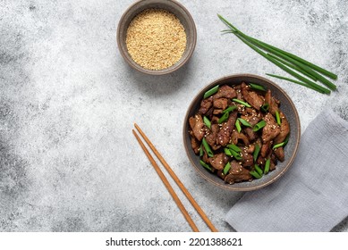 Bulgogi With Fried Pork. Traditional Korean Food. Gray Grunge Background. Top View, Flat Lay, Copy Space.