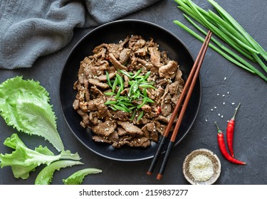 Bulgogi With Rice On A Black Background, Korean Food, Flat Lay