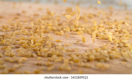 Bulgur Raw Grits In A Pile With Grains Falling From Above. Falling Food