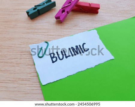 Bulimic writting on table background.