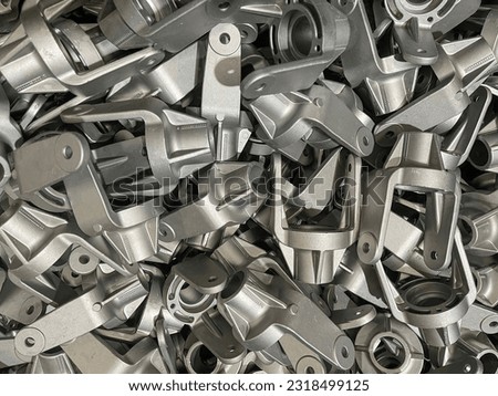 bulk aluminum forks, lot of die cast aluminum parts placed on mass, automotive parts mass production, mass production of die casting parts, aluminum die cast parts mass production ストックフォト © 
