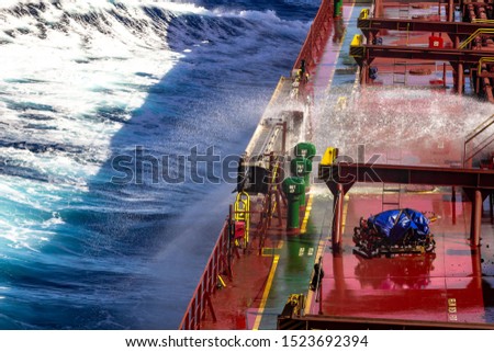 Bulk cargo ship underway with opened hatch covers