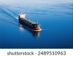 Bulk carrier or bulker underway in sea, ship for unpackaged bulk dry cargo, Aerial drone view