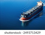 Bulk carrier or bulker underway in sea, ship for unpackaged bulk dry cargo, Aerial drone footage