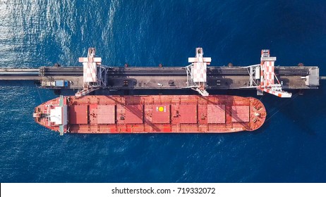 Bulk carrier docked in a Mediterranean port - Top down aerial view