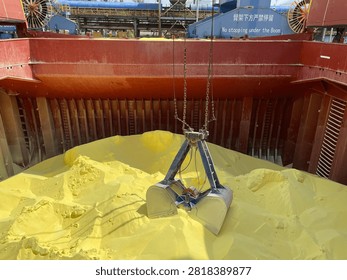 The bulk carrier is engaged in loading sulfur cargo for export through maritime transportation.