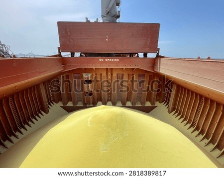 The bulk carrier is engaged in loading sulfur cargo for export through maritime transportation.