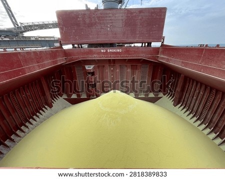 The bulk carrier is engaged in loading sulfur cargo for export through maritime transportation.