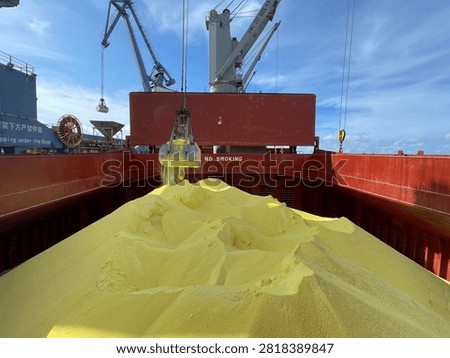 The bulk carrier is engaged in loading sulfur cargo for export through maritime transportation.
