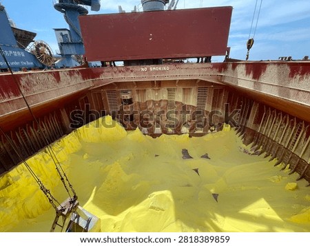 The bulk carrier is engaged in loading sulfur cargo for export through maritime transportation.