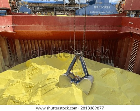 The bulk carrier is engaged in loading sulfur cargo for export through maritime transportation.