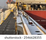 Bulk carrier ship cargo hold hatch cover trackway cover by potash cargo residue.