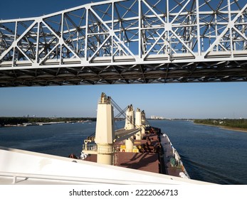 Bulk Carrier Ship Passing Under Bridge