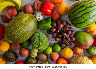 bulk fruits and vegetables. Piel de sapo melon, green broccoli, red watermelon, red grapes, limes, ripe peaches, nectarines and avocados, mango and peppers