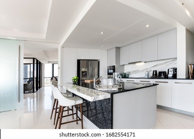 Bulk Head Inside A Modern Kitchen With Stone Bench