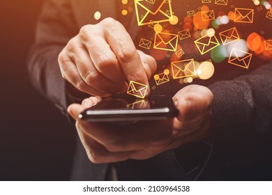 Bulk messaging, businessman sending large amount of SMS messages on smartphone, closeup of hands with selective focus - Shutterstock ID 2103964538