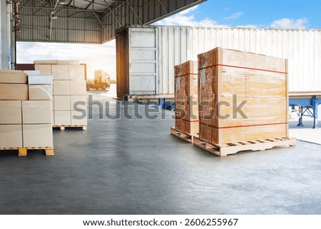Bulk of Package Boxes Waiting to be Loaded into Containers Trucks. Distribution Shipping Cargo Container. Semi Trailer Trucks on The Parking Lot at Sunset. Freight Truck Logistics Transportation.	

