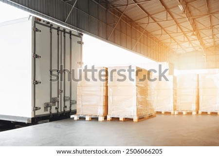 Bulk Pallets of Package Boxes Wrapped Plastic Stacked on Pallets. Trucks Loading at Warehouse Dock. Distribution Warehouse Shipping, Supply Chain Supplies, Shipment. Freight Truck Logistics Transport.