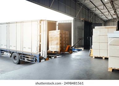 Bulk pallets of packaging boxes being loaded onto a container truck. distribution warehouse Container transport, supply chain, parcel delivery. Freight truck, logistics, transportation.