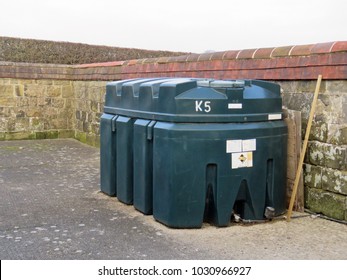 Bulk Plastic Fuel Oil Storage Tank In A Small Court Yard                             