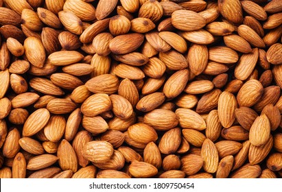 A bulk of raw almonds peel as a background, dried food - Shutterstock ID 1809750454
