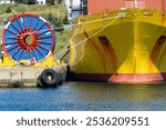 Bulk sub-sea industrial glass fiber optic cable on a metal spool on a ship