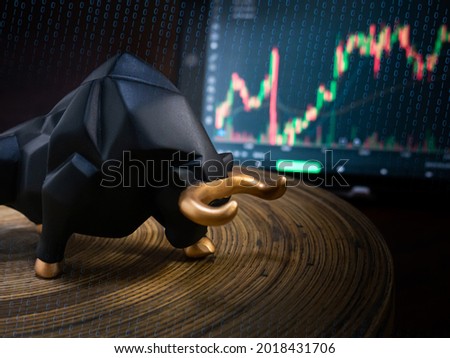 The bull and chart for business or bull market trader concept
