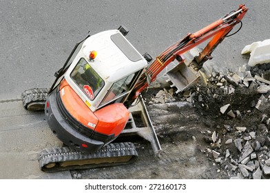 bulldozer excavator construction machine industry picks up debris on city street