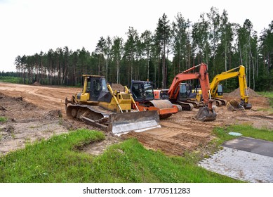 Bulldozer, Excavator And Soil Compactor On Road Work. Earth-moving Heavy Equipment And Construction Machinery  During Land Clearing, Grading, Pool Excavation, Utility Trenching And Digging