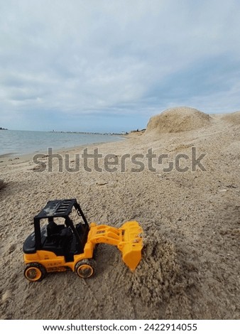 Bulldozer Kids Toys. Beach Sand.