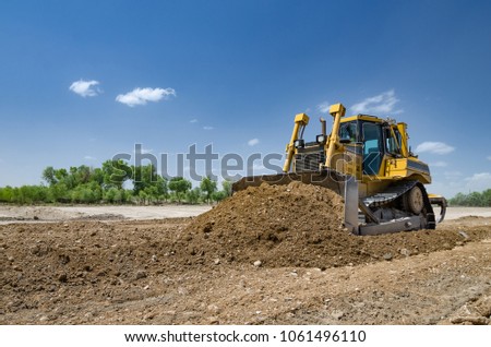 The bulldozer level the ground
