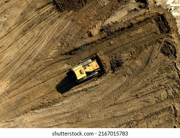 Bulldozer At Mine Reclamation Once Mining Sand Is Completed. Land Clearing, Grading, Pool Excavation, Utility Trenching. Dozer During Road Construction On Construction Site. 