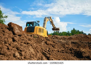 Bulldozer in open field operation - Shutterstock ID 1105821425