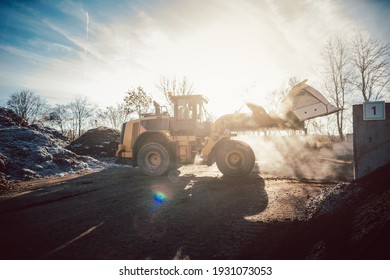 Bulldozer Putting Biomass On Pile For Composting In Industrial Facility